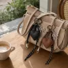 This black and brown heart-shaped keychain set is a fashionable and simple pendant suitable for both men and women details Picture